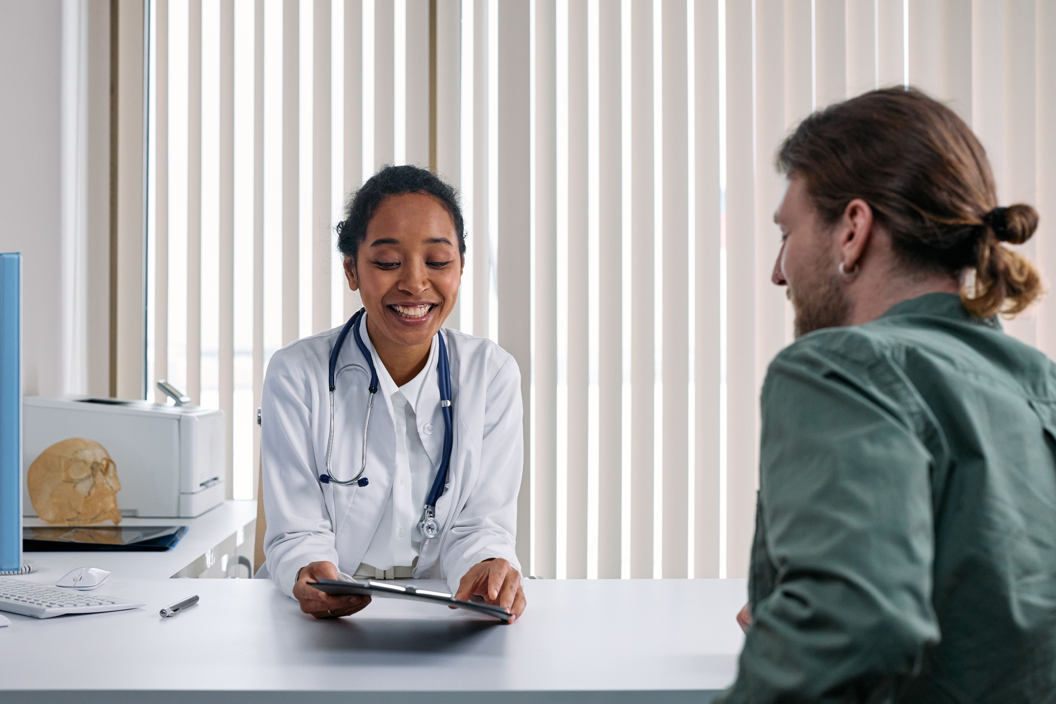 Doctor consulting with a patient during a health assessment